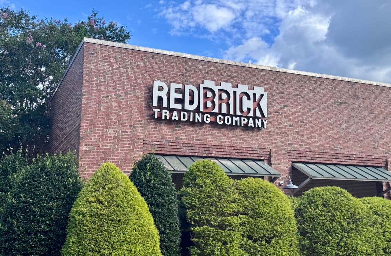 The Red Brick Trading Company sign on the front of the building